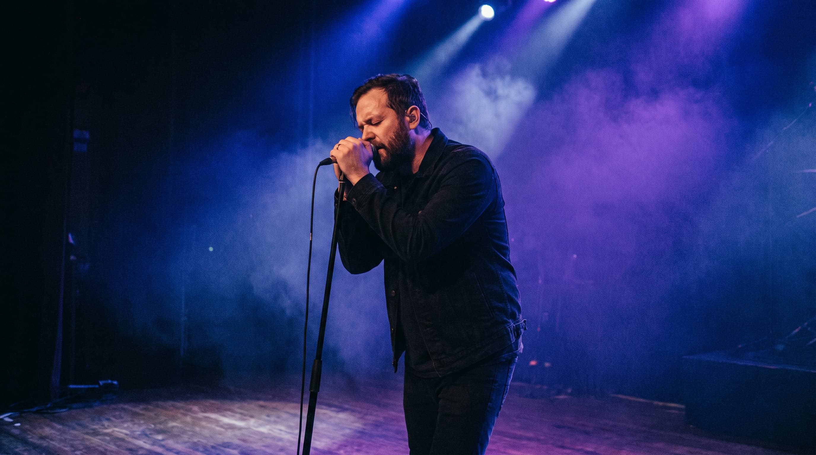 singer holding microphone